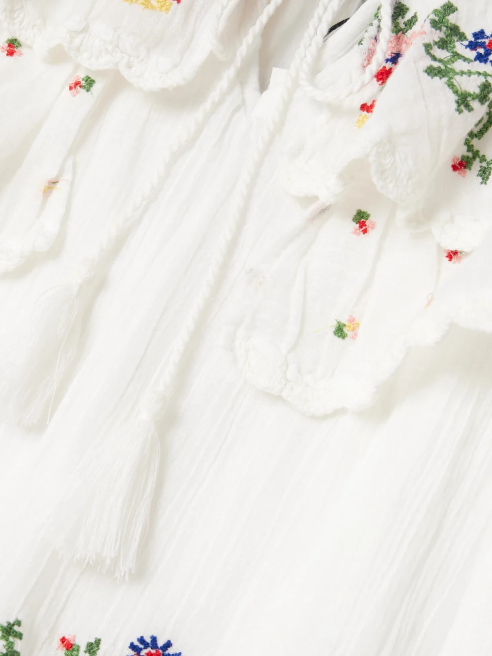 Close-up detail of the Rixo Leilani Tiered Embroidered Cotton-voile Mini Dress
