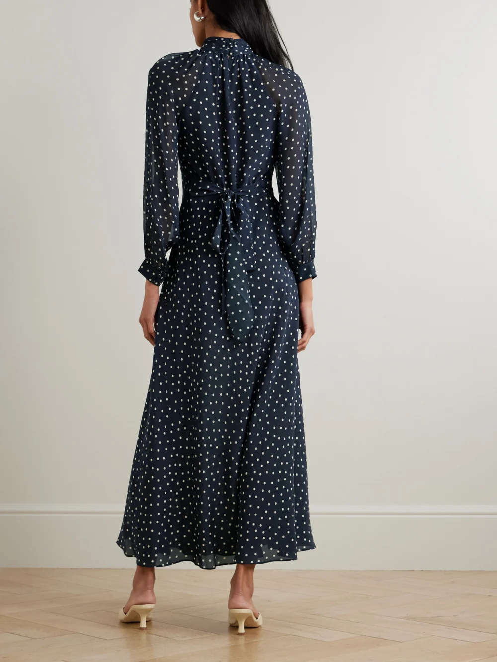 Back view of the Rixo Paige Belted Polka-dot Silk-chiffon Mock-neck Midi Dress