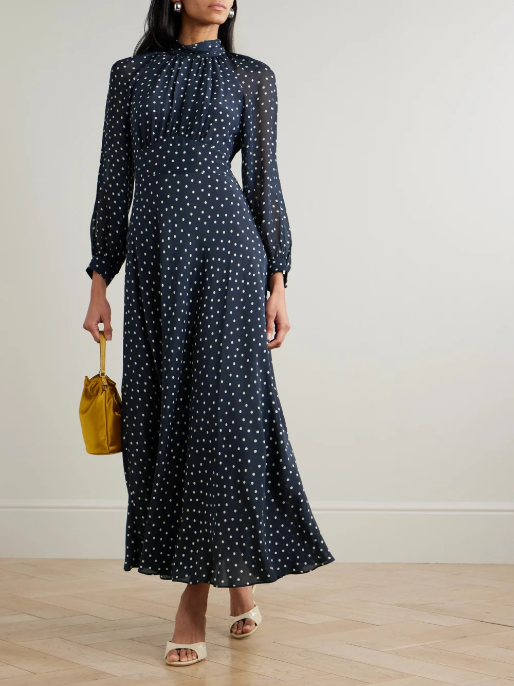 Rixo Paige Belted Polka-dot Silk-chiffon Mock-neck Midi Dress, worn by a model