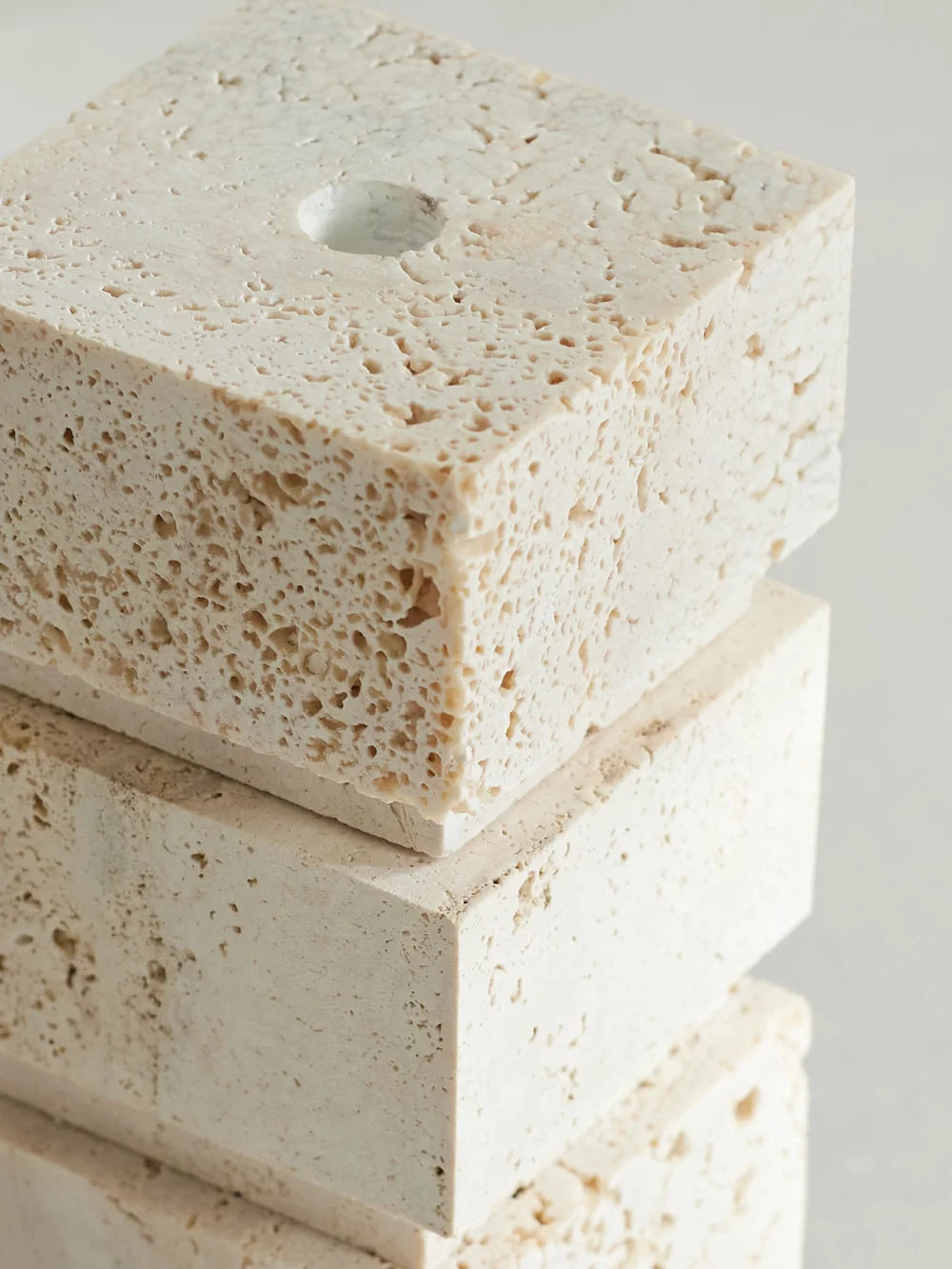 Close-up detail of the Róhe Small Travertine Candleholder