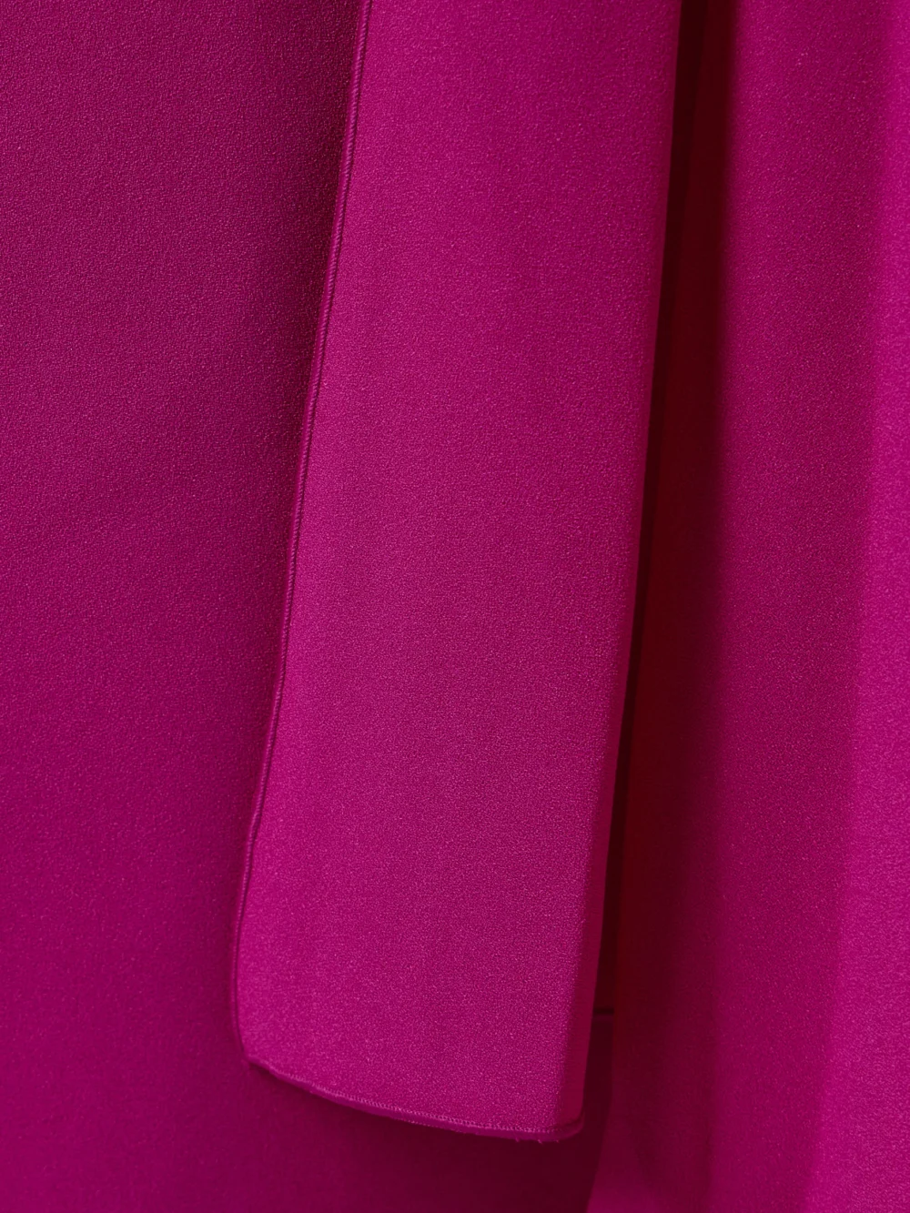 Close-up detail of the Roksanda Demetria Cape-effect Pleated Crepe Gown