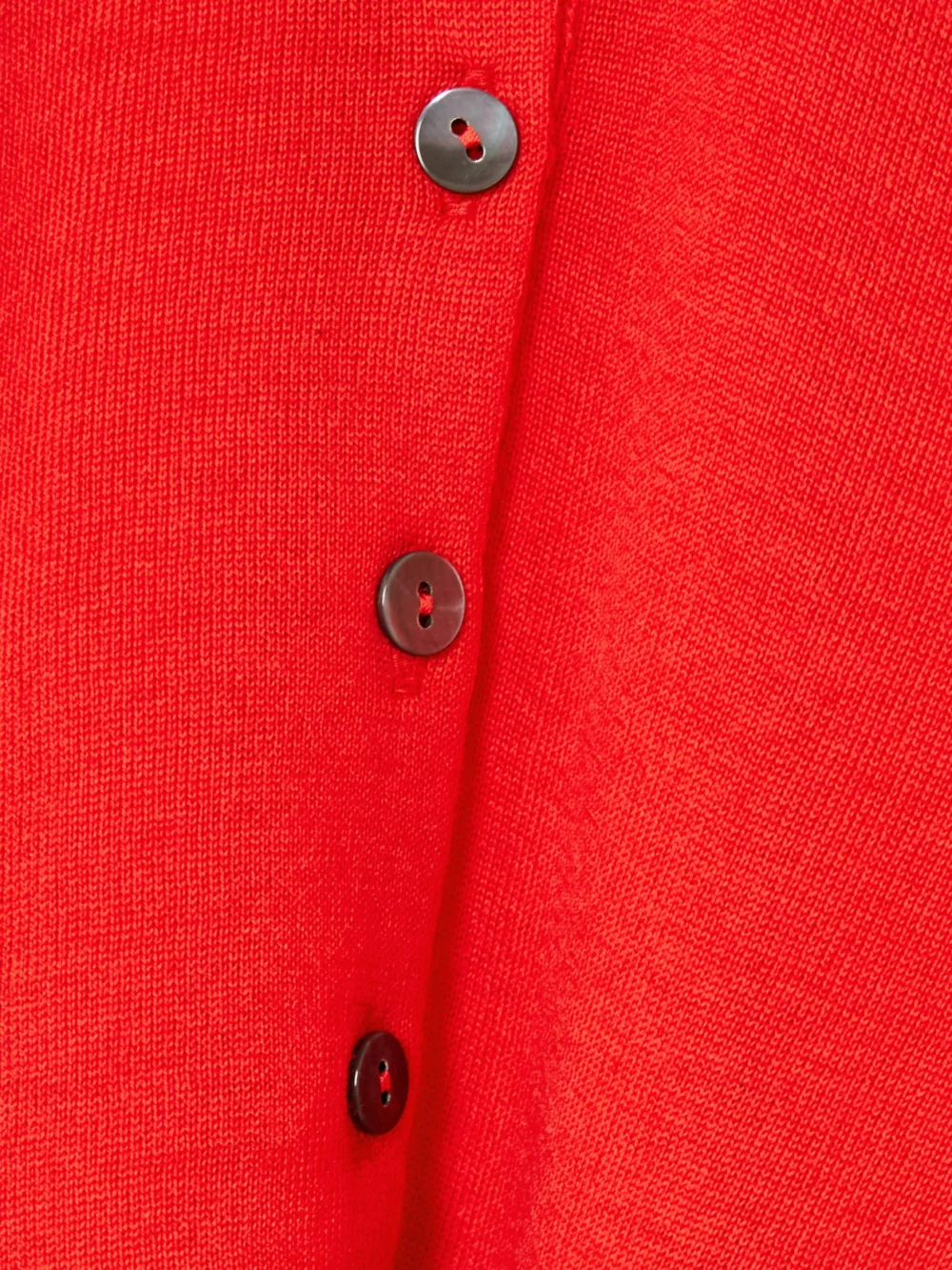 Close-up detail of the Rùadh Dea Embroidered Merino Wool Polo Sweater