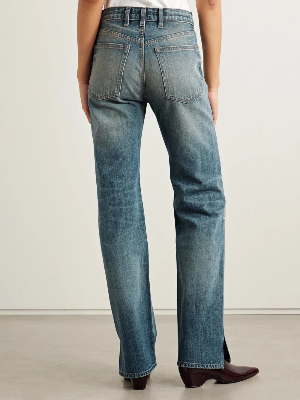 Back view of the Rùadh The Agnes Distressed Mid-rise Straight-leg Jeans