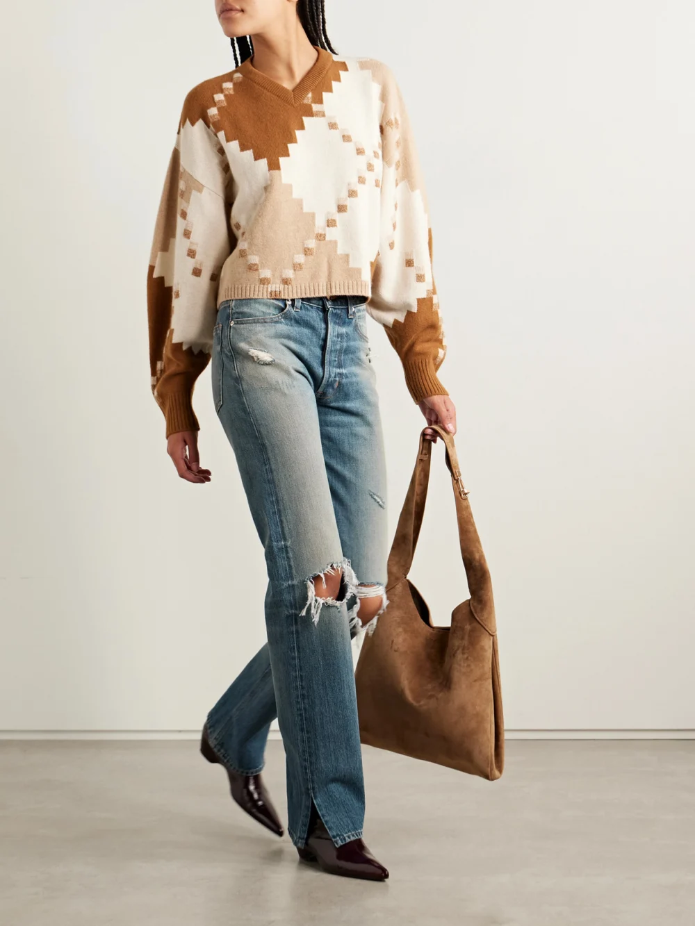 Rùadh The Agnes Distressed Mid-rise Straight-leg Jeans, worn by a model
