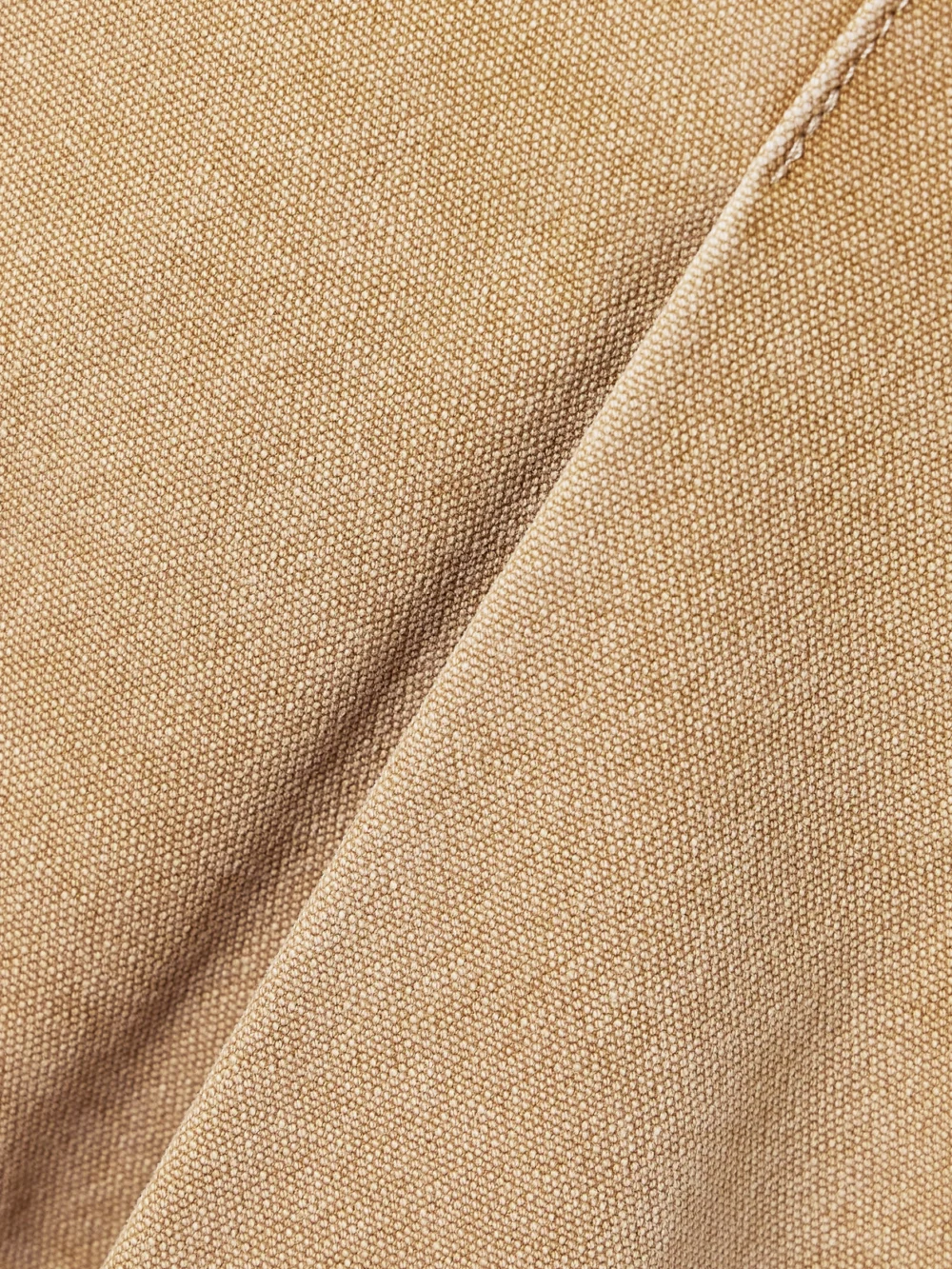 Close-up detail of the Rùadh The Kenna Pleated Cotton-canvas Mini Skirt
