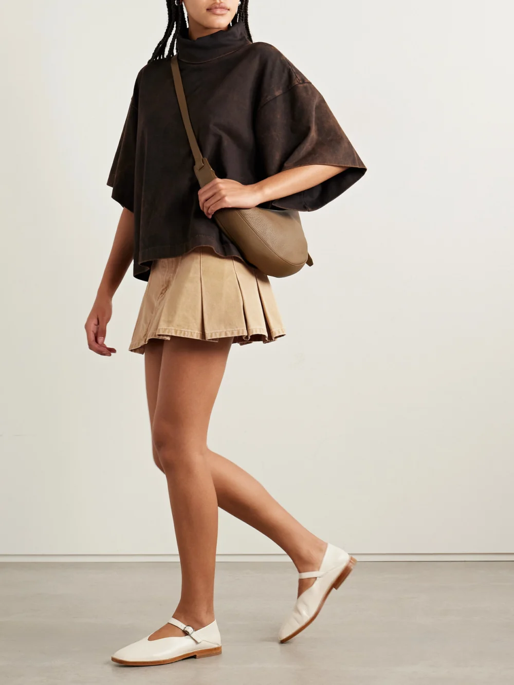 Rùadh The Kenna Pleated Cotton-canvas Mini Skirt, worn by a model