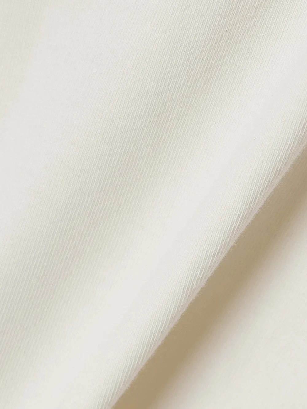 Close-up detail of the Rùadh The Orbital Organic Cotton-jersey Turtleneck T-shirt