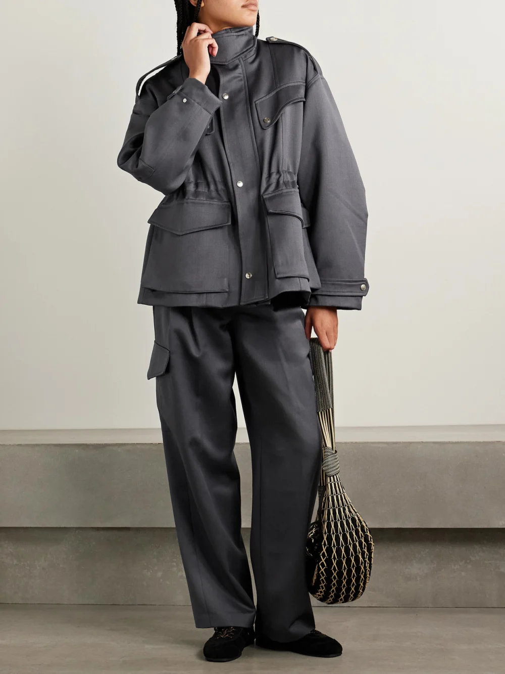 Rùadh The Russel Pleated Wool Wide-leg Pants, worn by a model