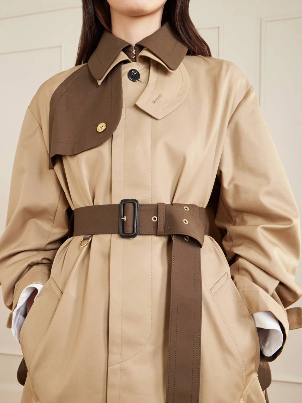 Close-up detail of the Sacai Belted Two-tone Cotton-blend Gabardine Trench Coat