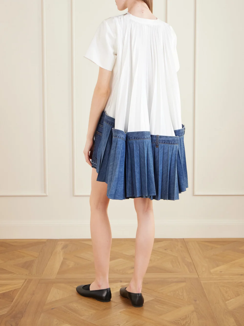 Back view of the Sacai Cape-effect Pleated Cotton and Silk-blend Jersey and Denim Mini Dress