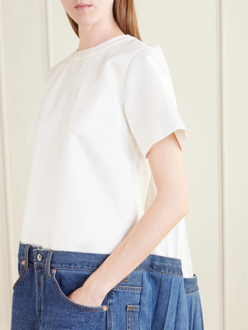 Close-up detail of the Sacai Cape-effect Pleated Cotton and Silk-blend Jersey and Denim Mini Dress