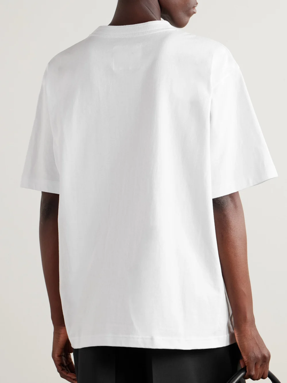 Back view of the Sacai + Carhartt Wip Appliquéd Canvas-trimmed Cotton-jersey T-shirt