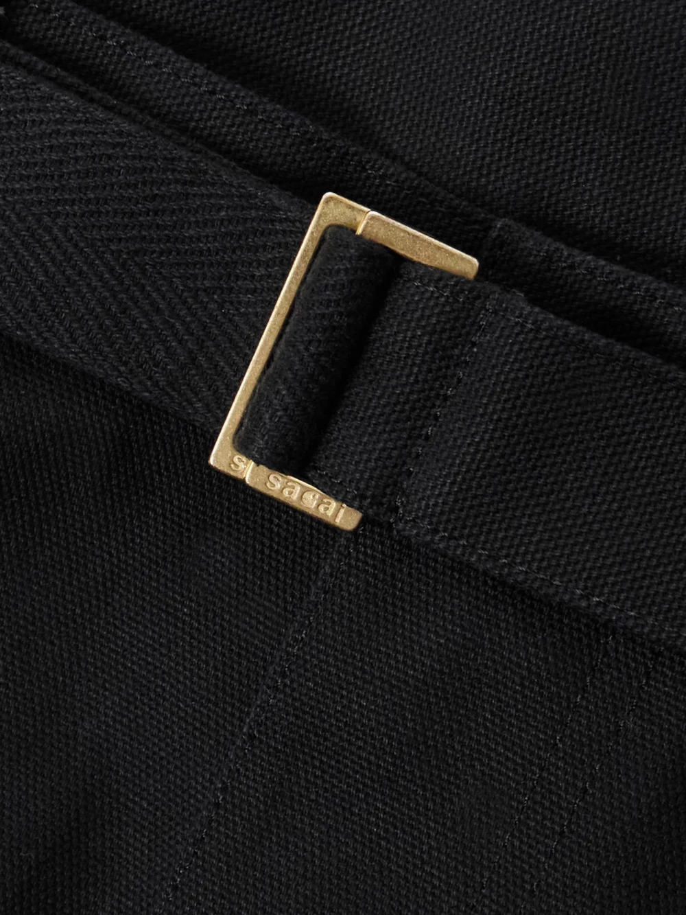 Close-up detail of the Sacai + Carhartt Wip Belted Draped Cotton-canvas Mini Skirt