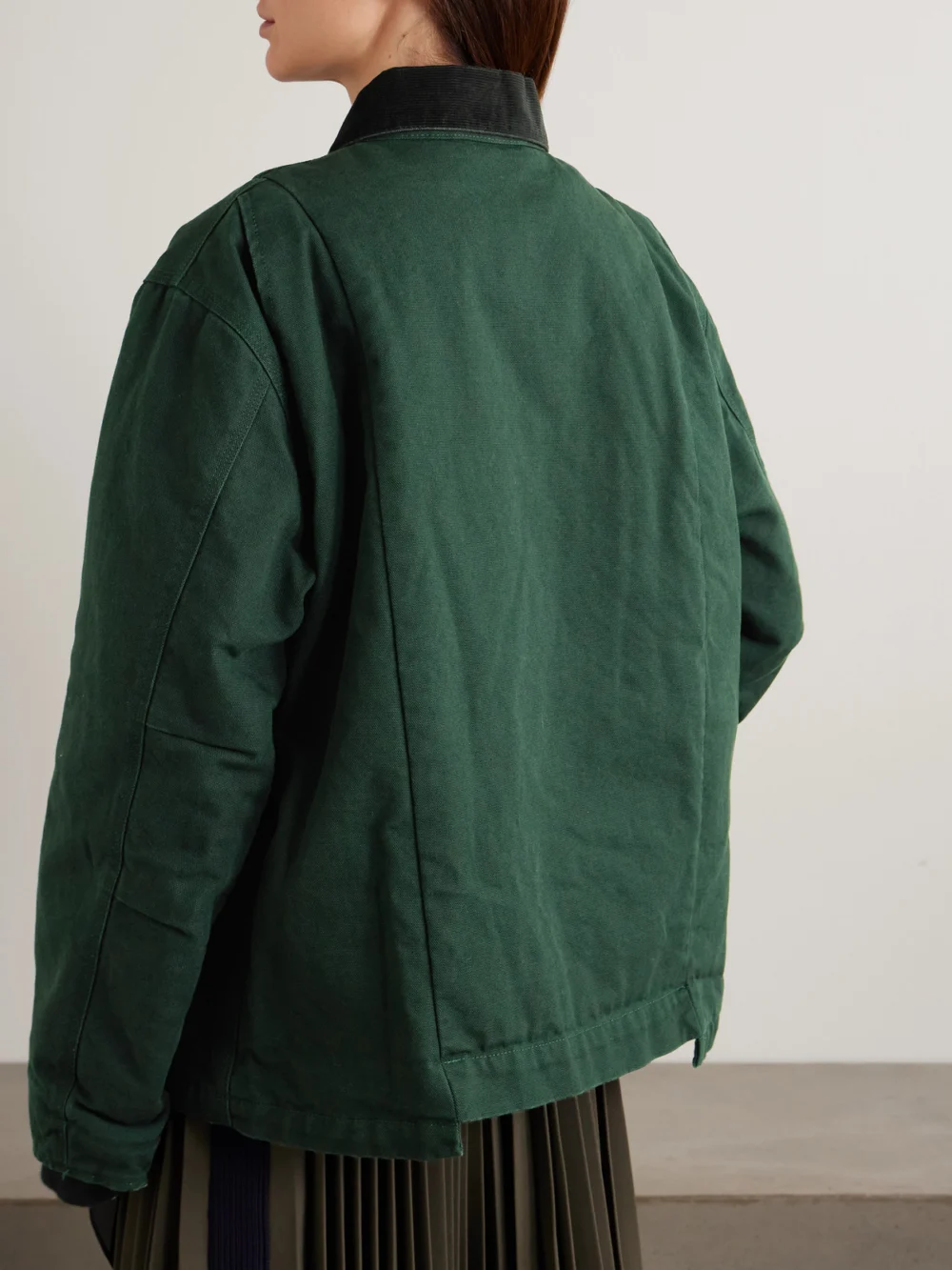 Back view of the Sacai + Carhartt Wip Duck Oversized Corduroy-trimmed Appliquéd Cotton-canvas Jacket