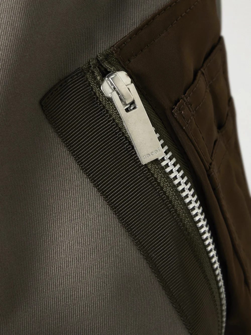 Close-up detail of the Sacai Cotton-canvas and Shell Bomber Jacket