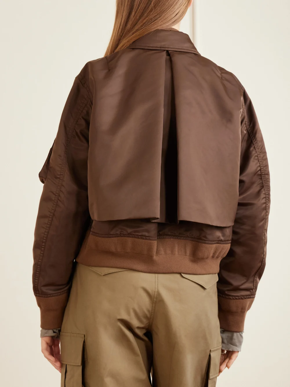 Back view of the Sacai Cropped Padded Shell Bomber Jacket