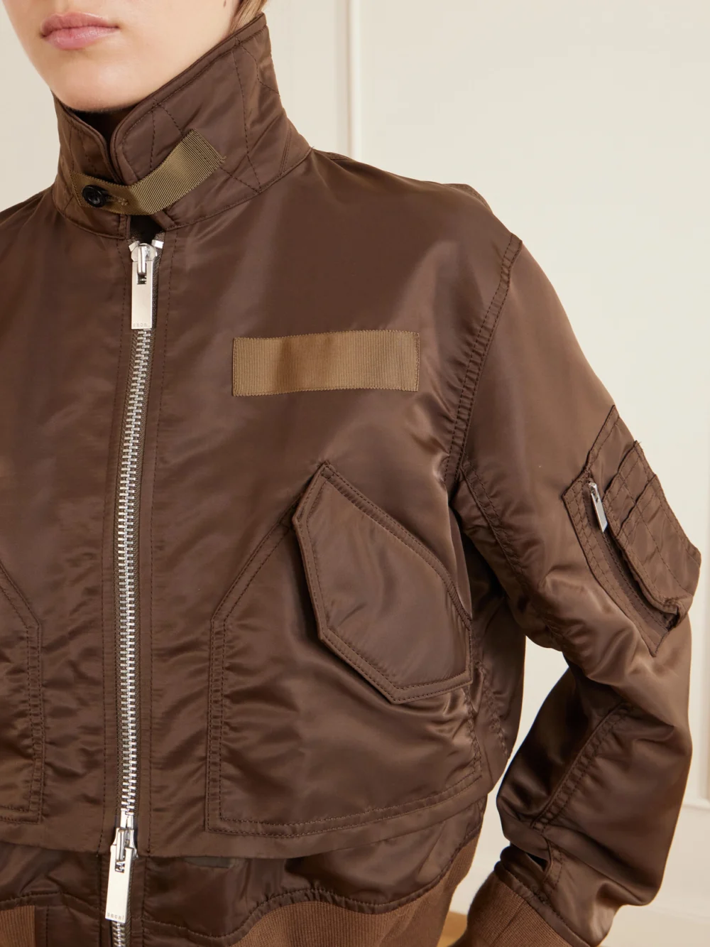 Close-up detail of the Sacai Cropped Padded Shell Bomber Jacket