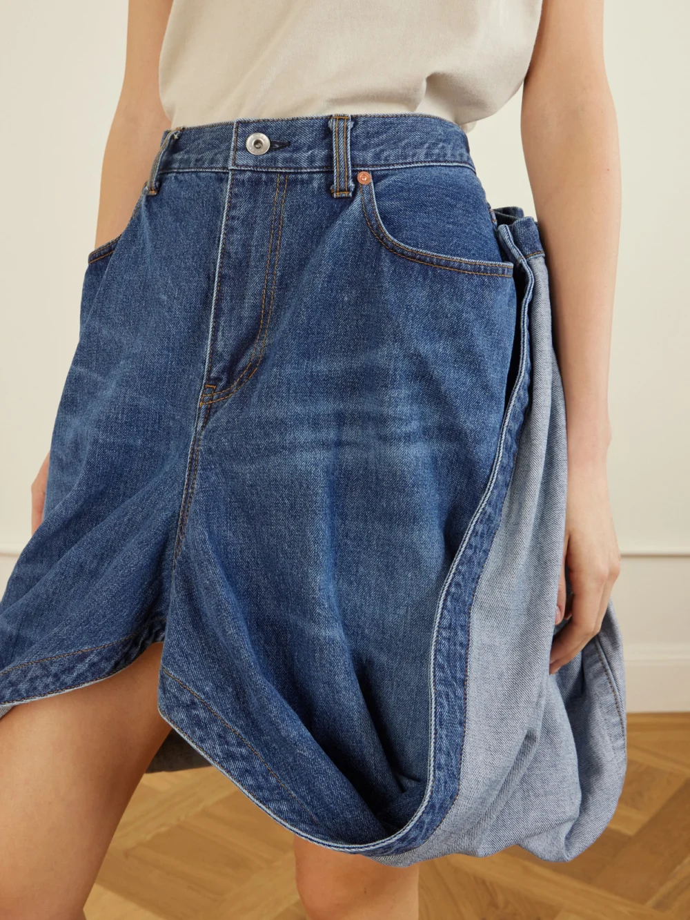 Close-up detail of the Sacai Folded Denim Skirt