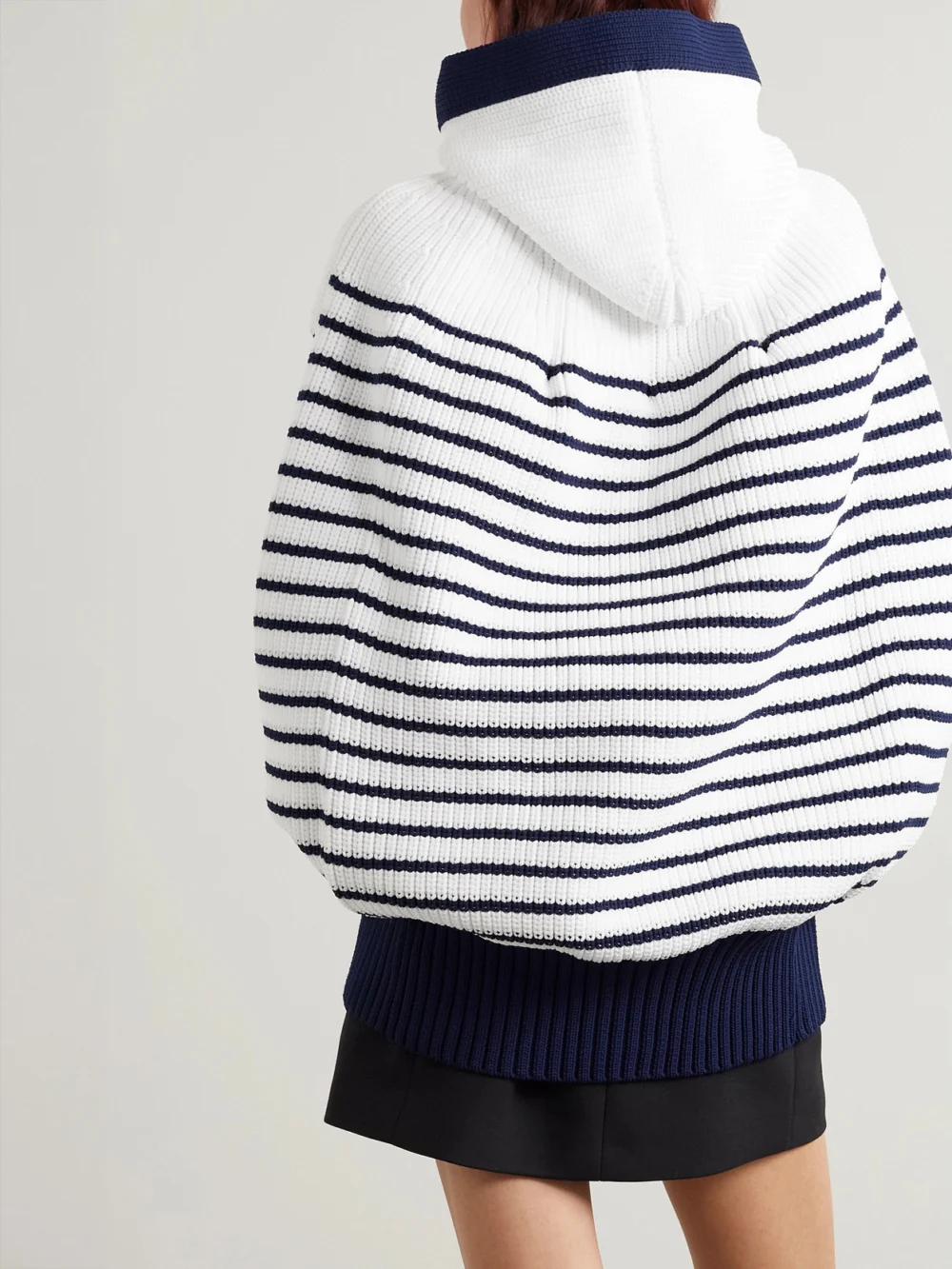 Back view of the Sacai Hooded Striped Ribbed-knit Cape