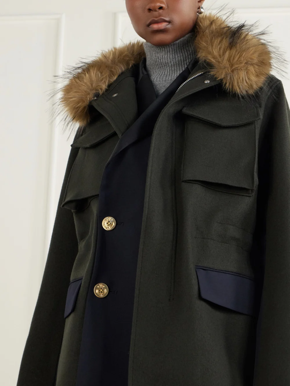 Close-up detail of the Sacai Layered Wool Coat