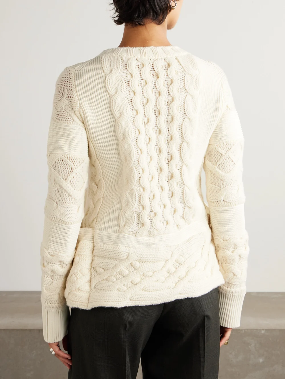 Back view of the Sacai Paneled Cable-knit Wool Sweater
