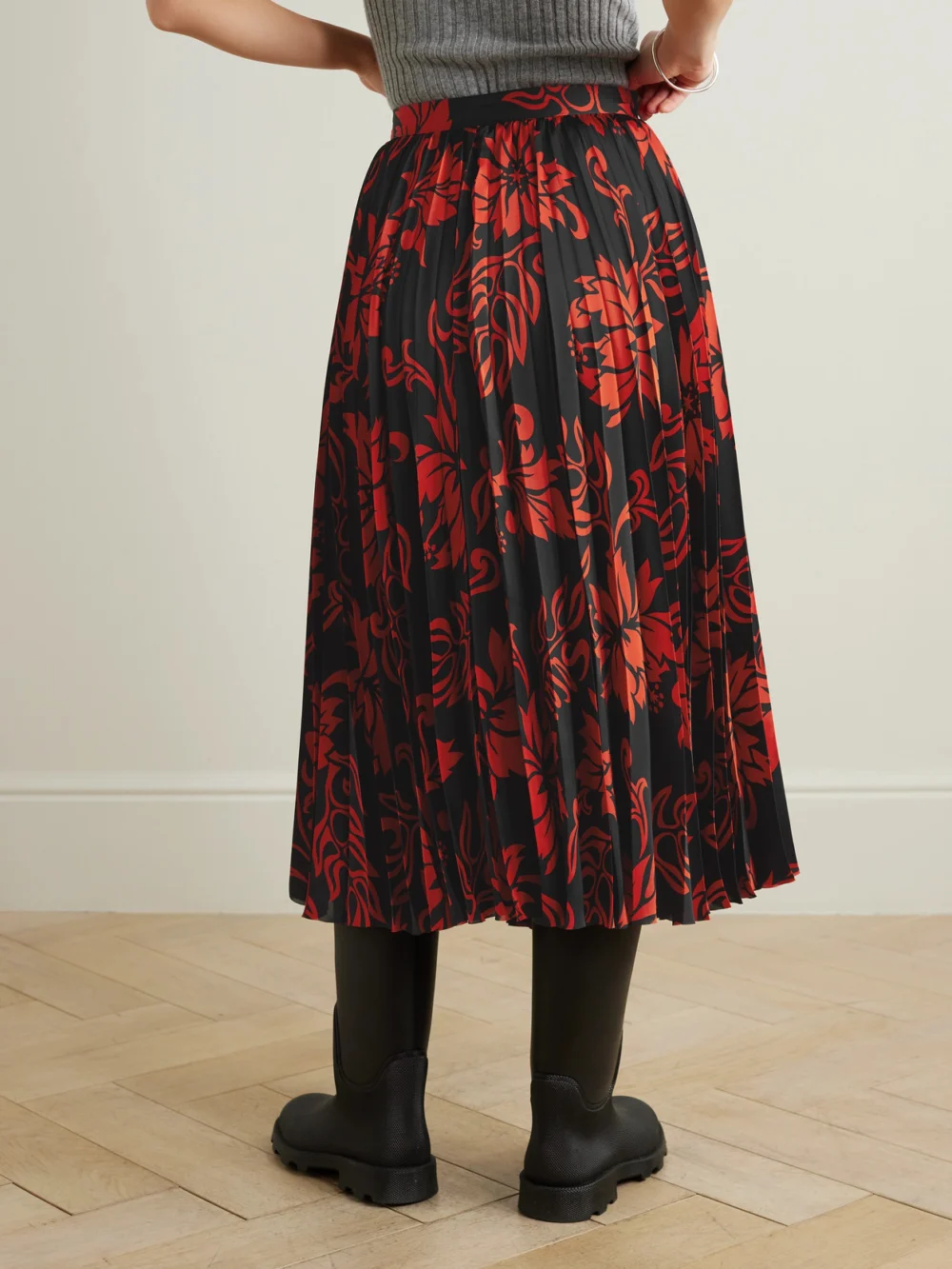 Back view of the Sacai Pleated Floral-print Satin Midi Skirt