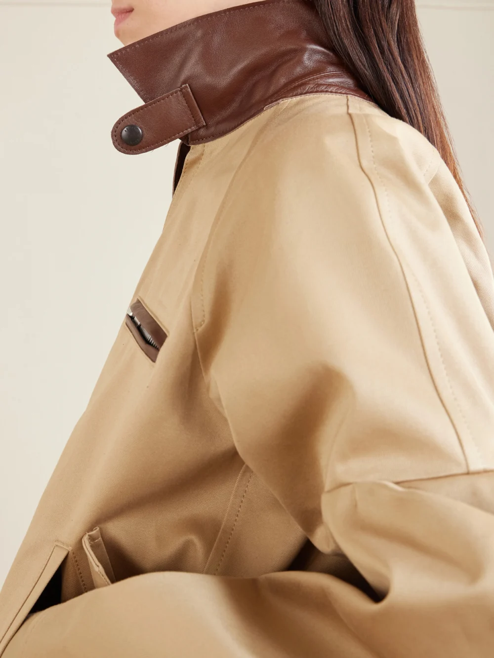 Close-up detail of the Sacai Pleated Leather-trimmed Cotton-twill Jacket