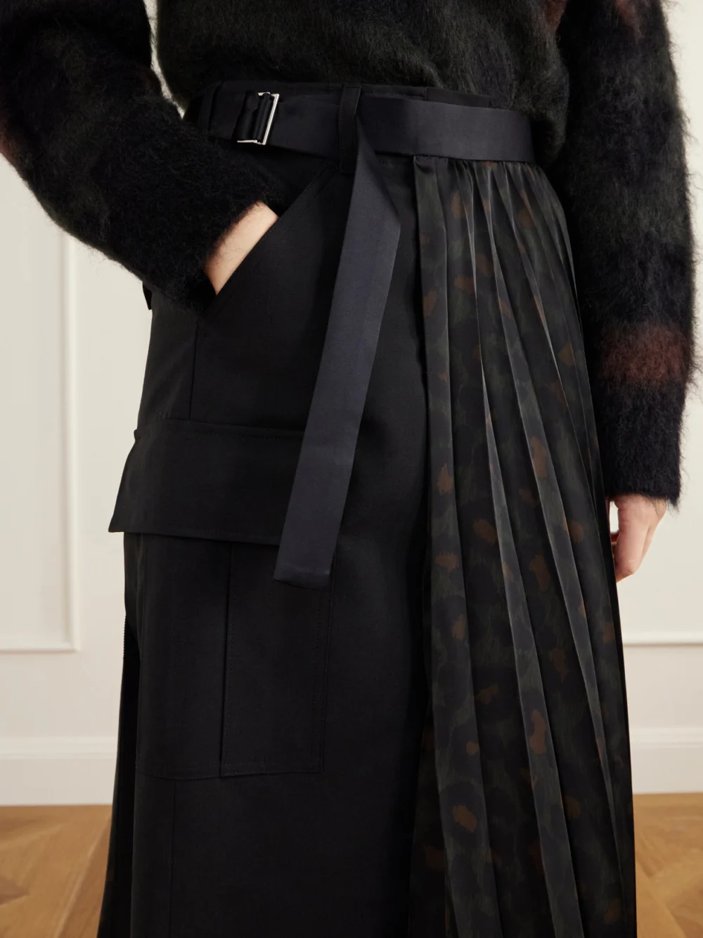Close-up detail of the Sacai Pleated Leopard-print Jersey and Satin Midi Skirt