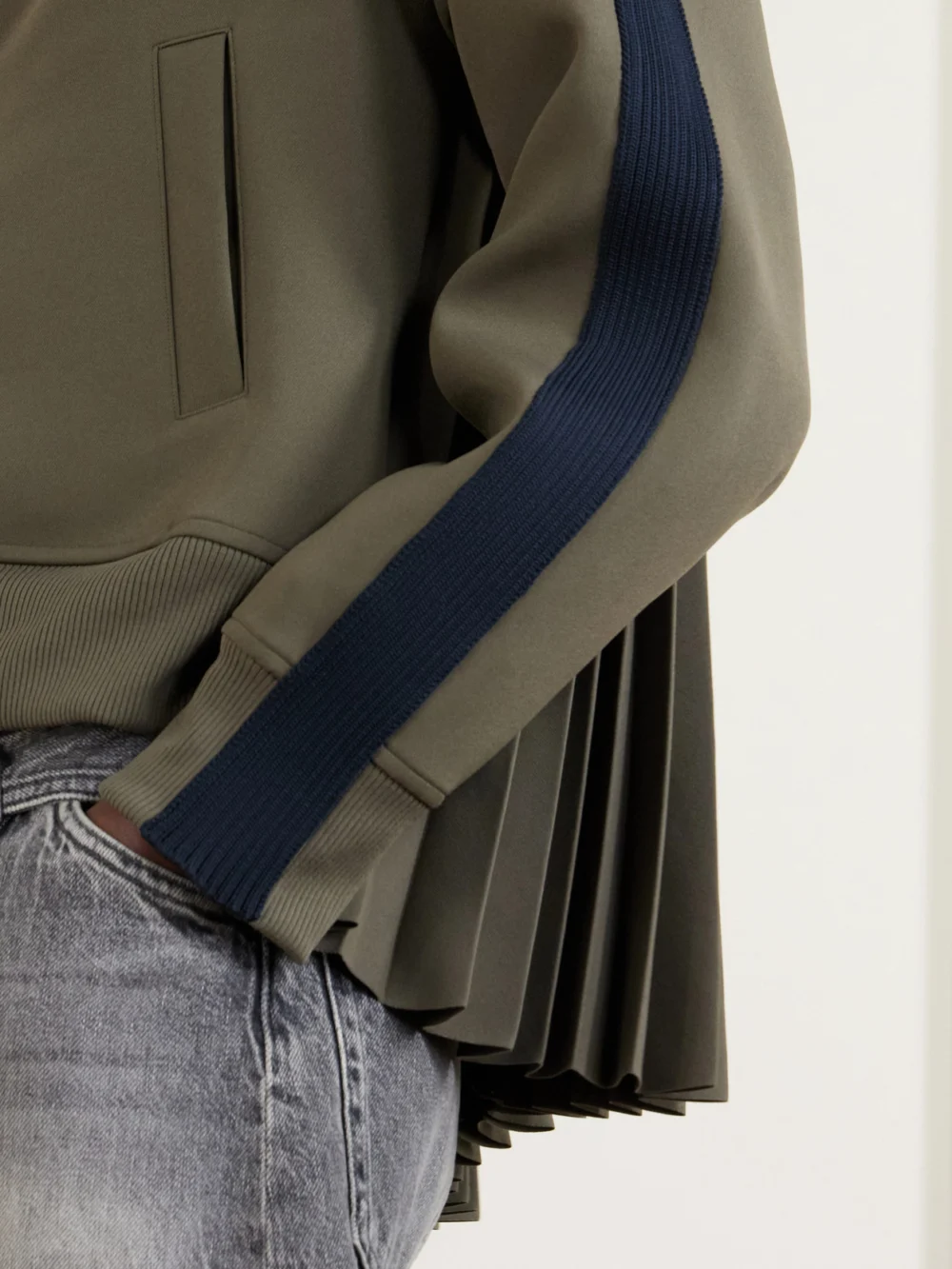 Close-up detail of the Sacai Pleated Tech-jersey Blouson Jacket