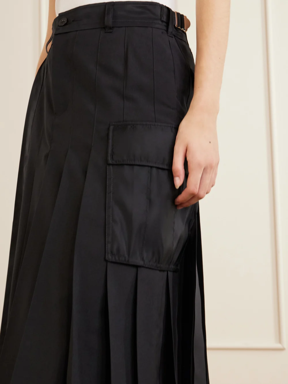 Close-up detail of the Sacai Pleated Twill and Shell Midi Skirt