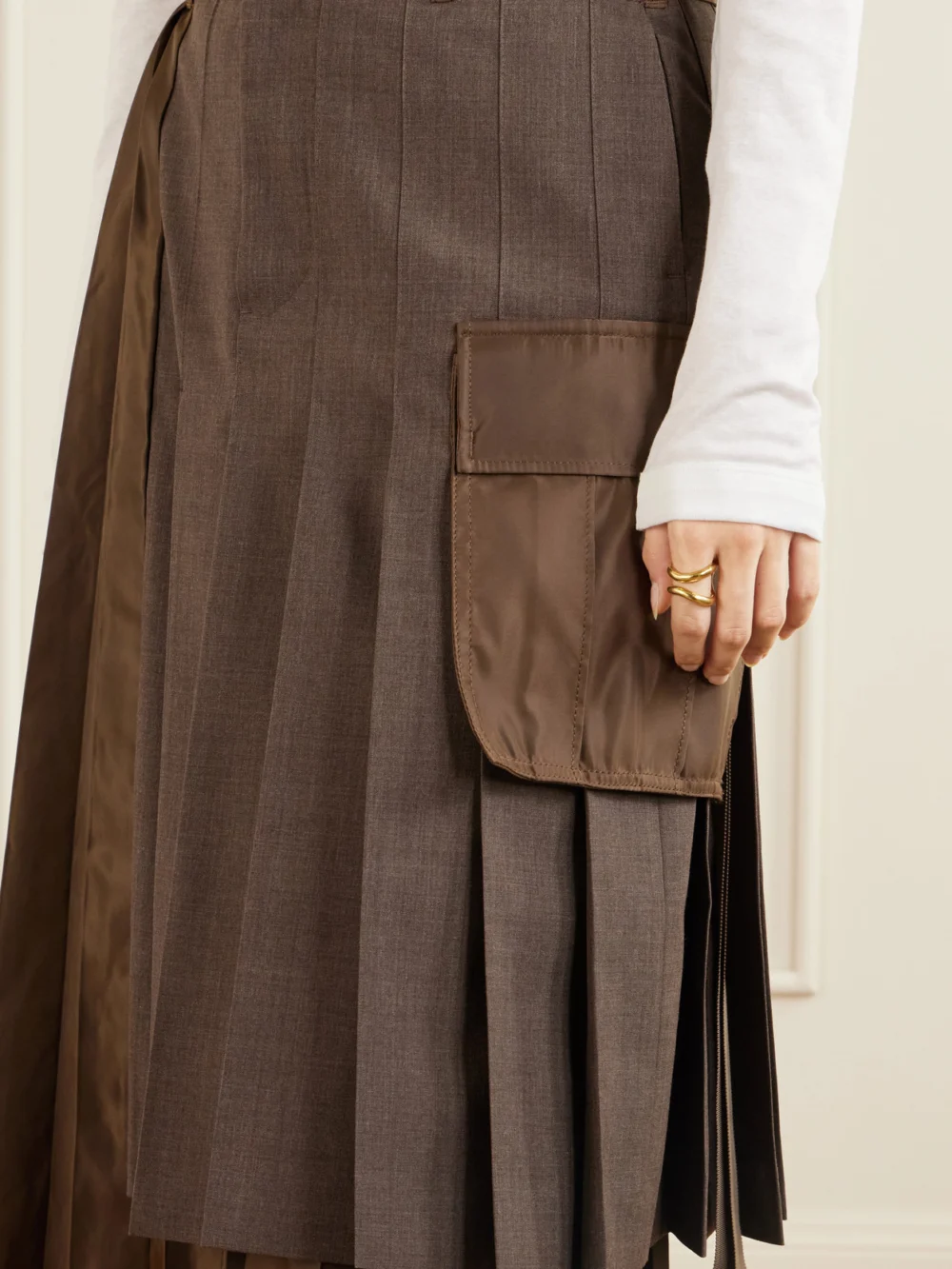 Close-up detail of the Sacai Pleated Twill and Shell Midi Skirt