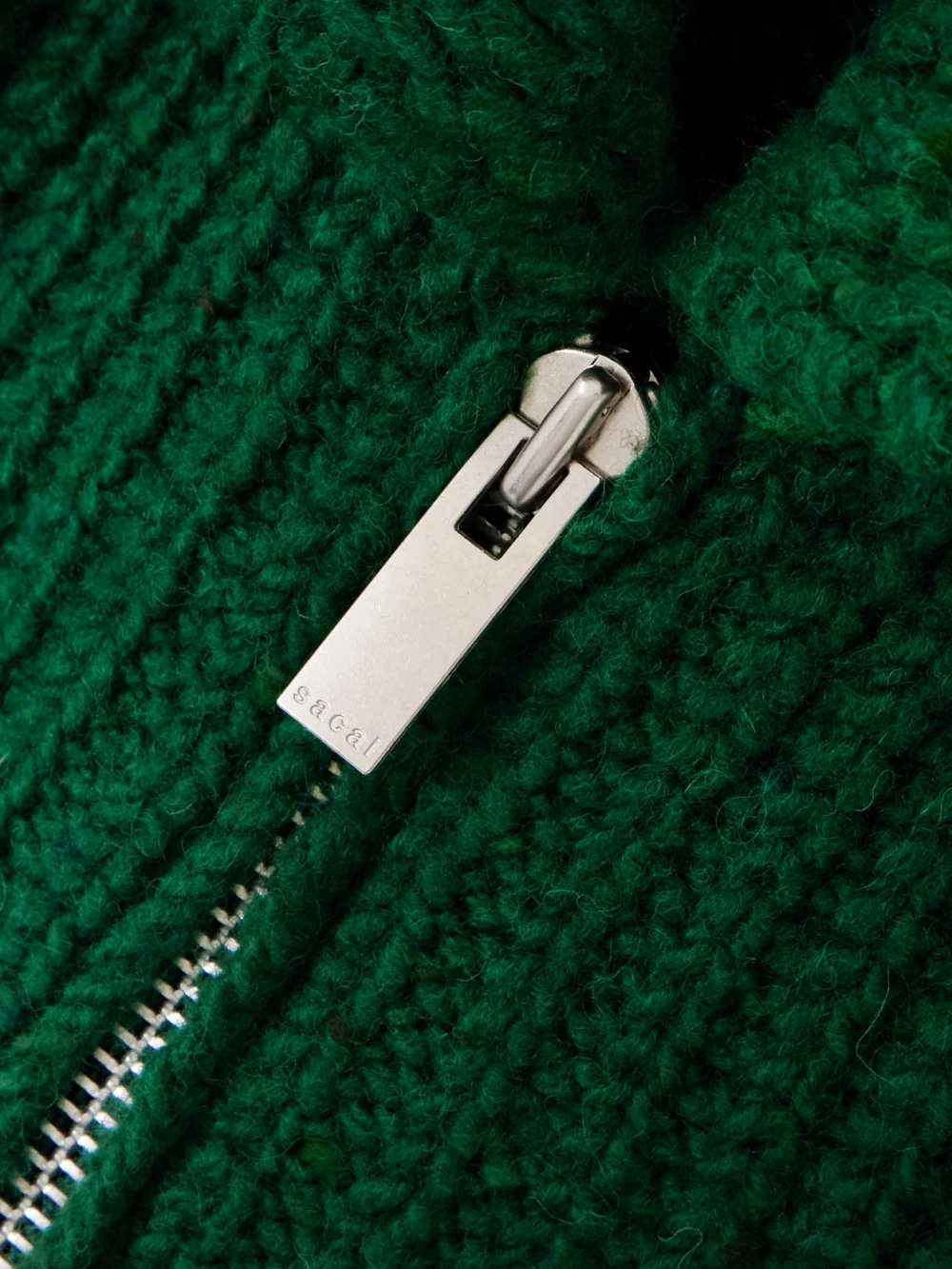 Close-up detail of the Sacai Ribbed Garment-dyed Wool Cardigan