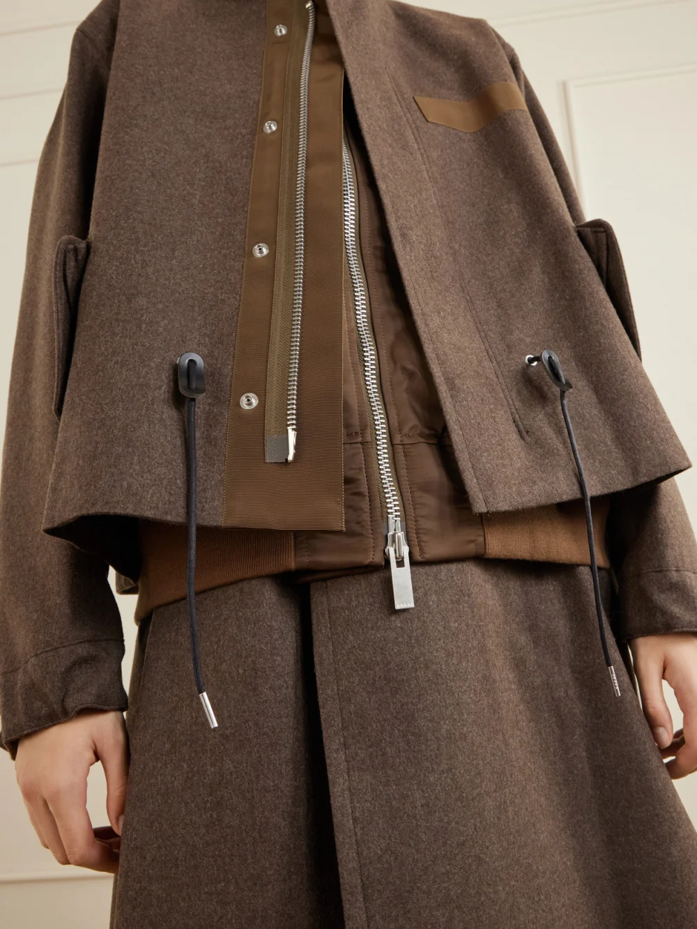 Close-up detail of the Sacai Shell-trimmed Wool-flannel Coat