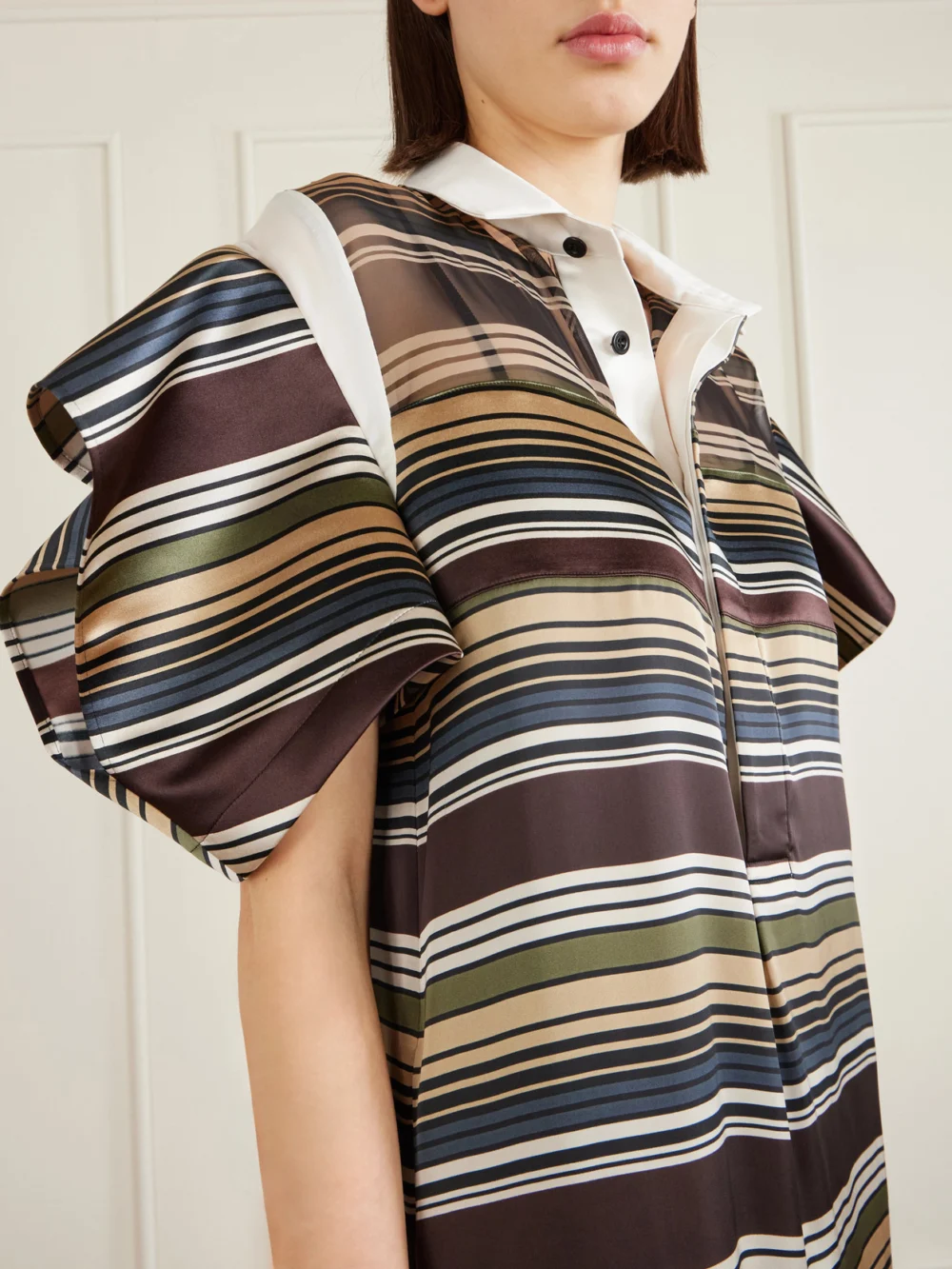 Close-up detail of the Sacai Striped Organza and Satin Midi Dress