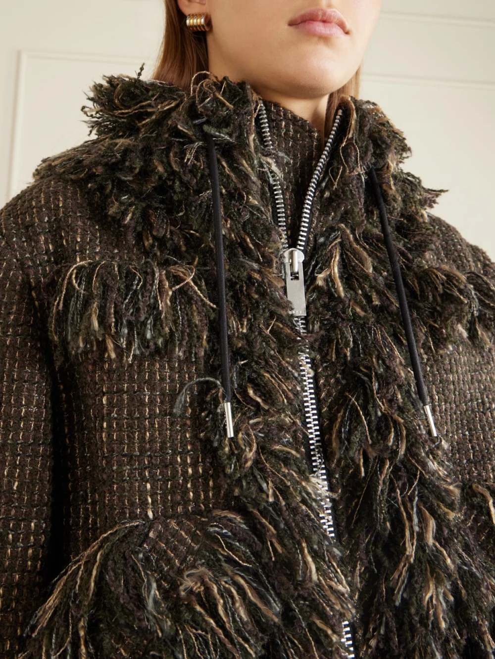 Close-up detail of the Sacai Wool-blend Frayed Tweed Zip-up Jacket