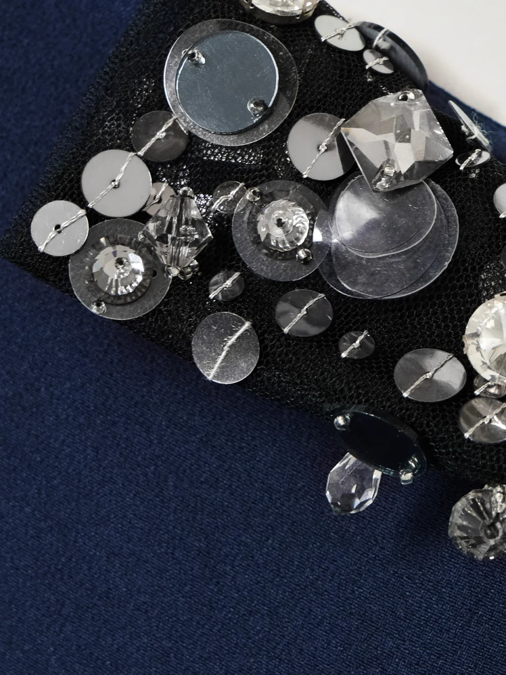 Close-up detail of the Safiyaa Aleyna Cape-effect Embellished Tulle-trimmed Crepe Gown