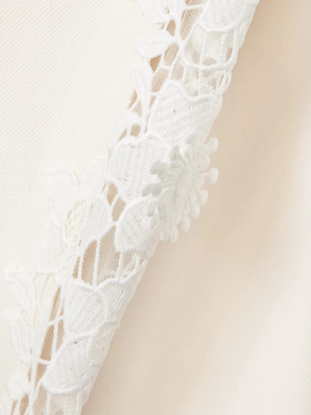 Close-up detail of the Safiyaa Fredan Guipure Lace-trimmed Cotton-twill Wide-leg Pants