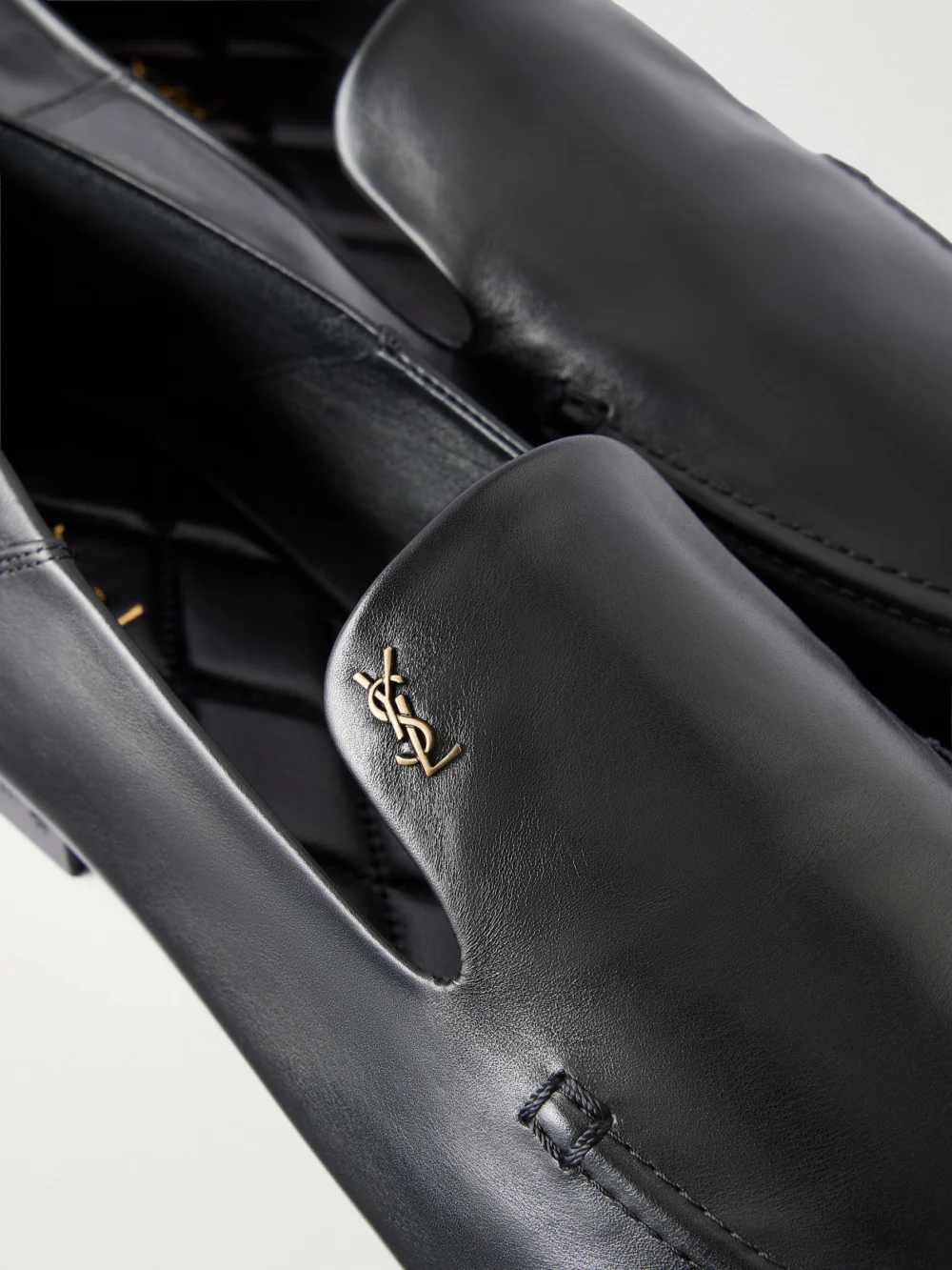 Close-up detail of the Saint Laurent Alain Cassandre-embellished Leather Loafer
