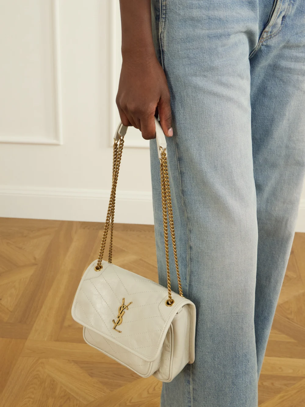 Saint Laurent Baby Niki Cassandre-embellished Quilted Crinckled-leather Shoulder Bag, styled view