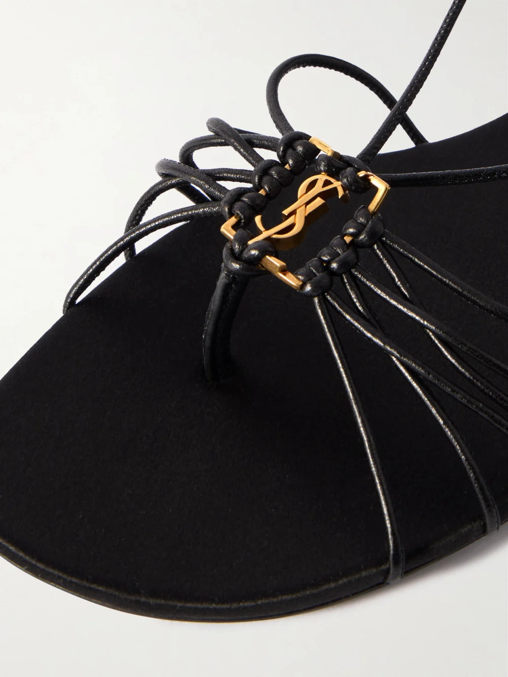 Close-up detail of the Saint Laurent Babylone Cassandre-embellished Leather Sandals