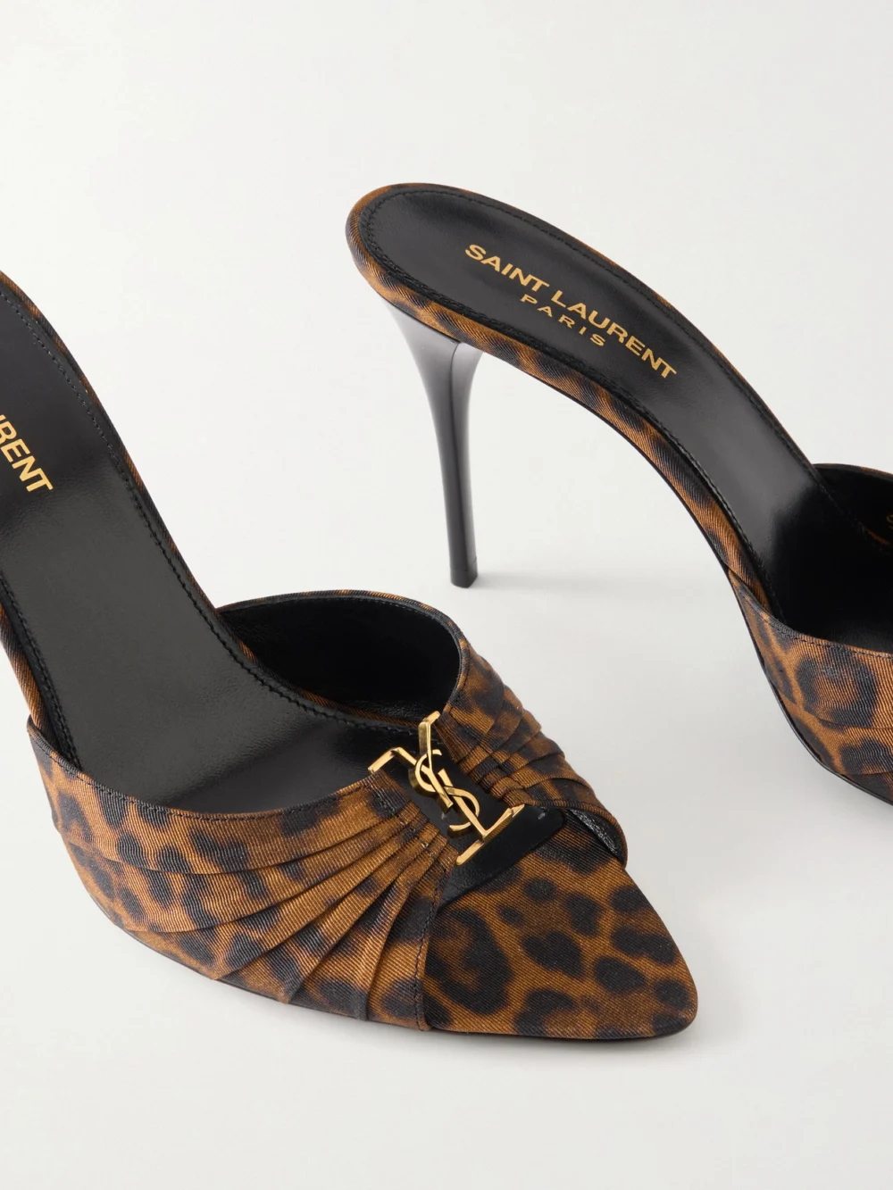 Close-up detail of the Saint Laurent Babylone Cassandre-embellished Leopard-print Faille Mules