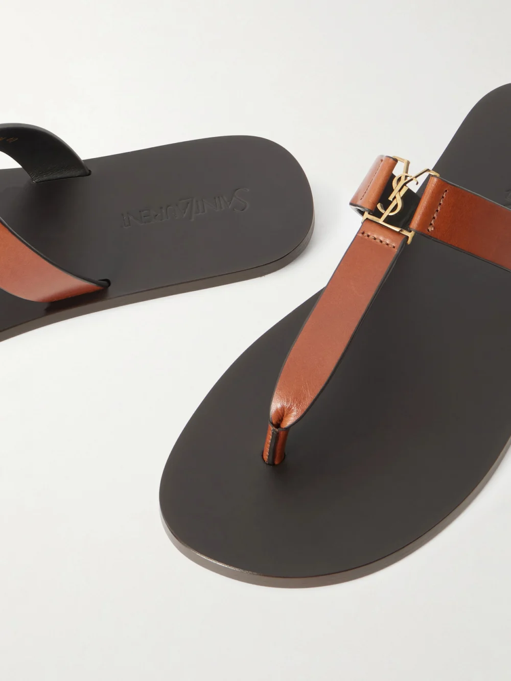Close-up detail of the Saint Laurent Cassandra Embellished Leather Thong Sandals