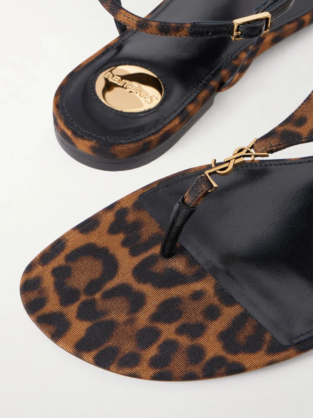 Close-up detail of the Saint Laurent Cassandra Embellished Leopard-print Faille Sandals