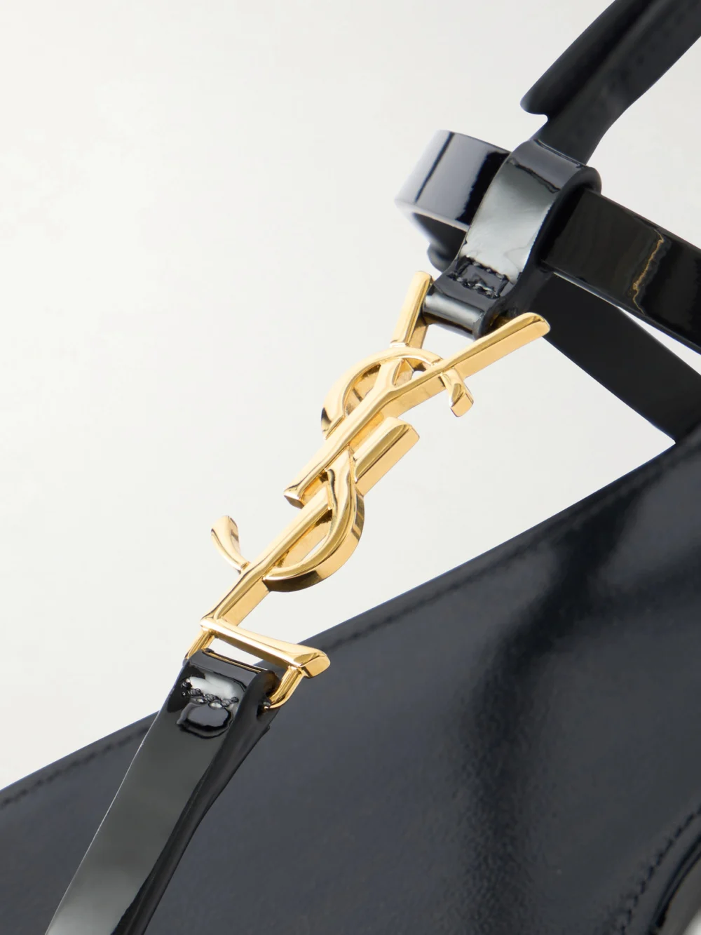 Close-up detail of the Saint Laurent Cassandre Embellished Patent Leather Sandals
