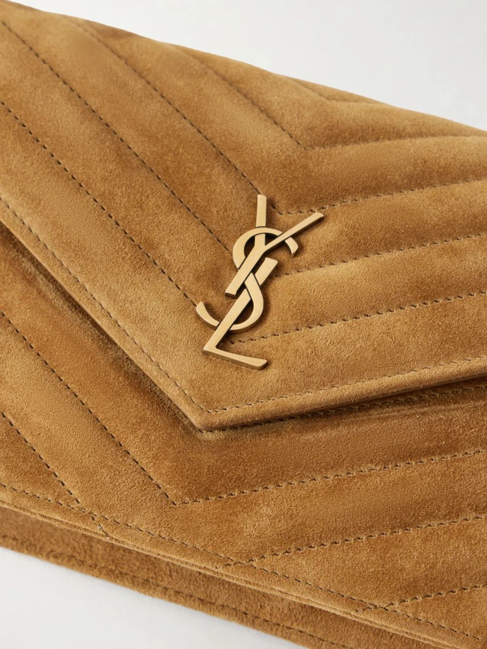 Close-up detail of the Saint Laurent Cassandre Envelope Matelassé Logo-detailed Suede Shoulder Bag