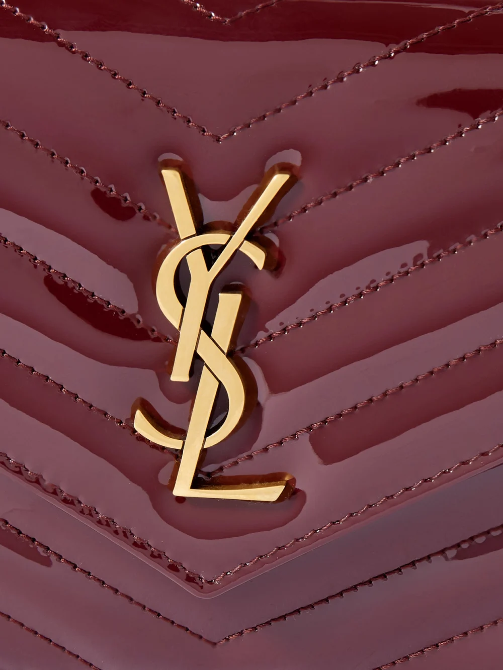 Close-up detail of the Saint Laurent Cassandre Envelope Matelassé Patent-leather Shoulder Bag