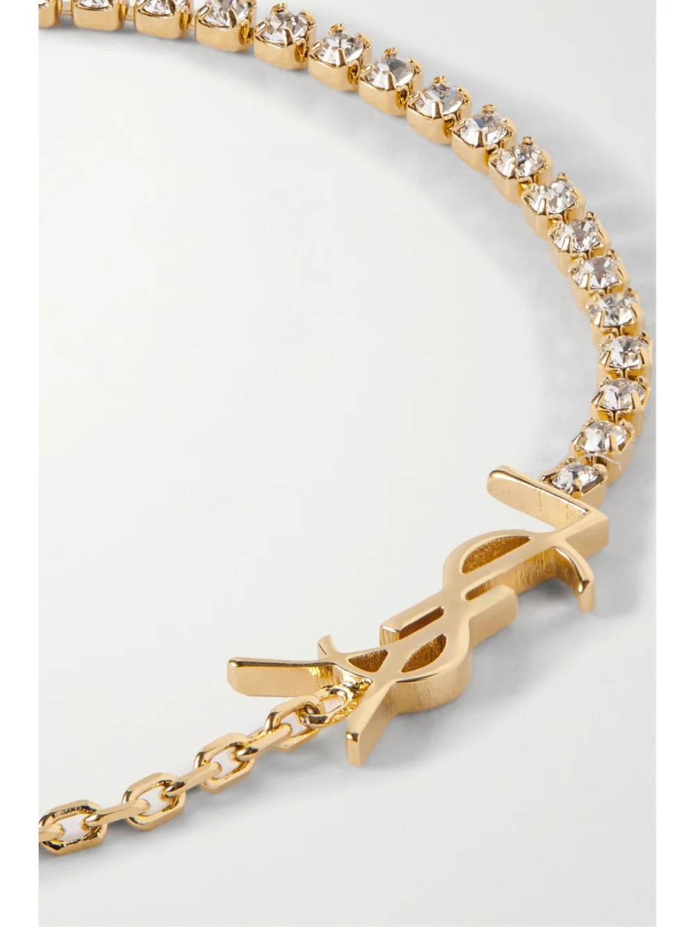 Close-up detail of the Saint Laurent Cassandre Gold-tone Crystal Bracelet