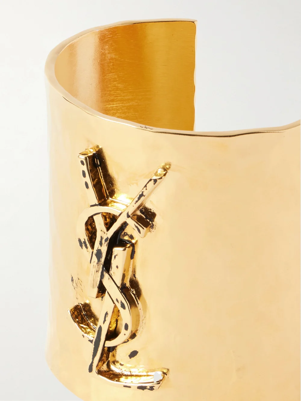 Close-up detail of the Saint Laurent Cassandre Gold-tone Cuff
