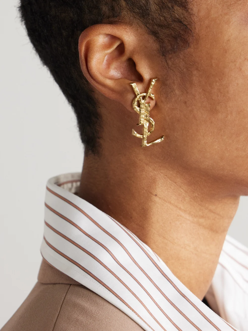 Saint Laurent Cassandre Hammered Gold-tone Single Clip Earring, styled view
