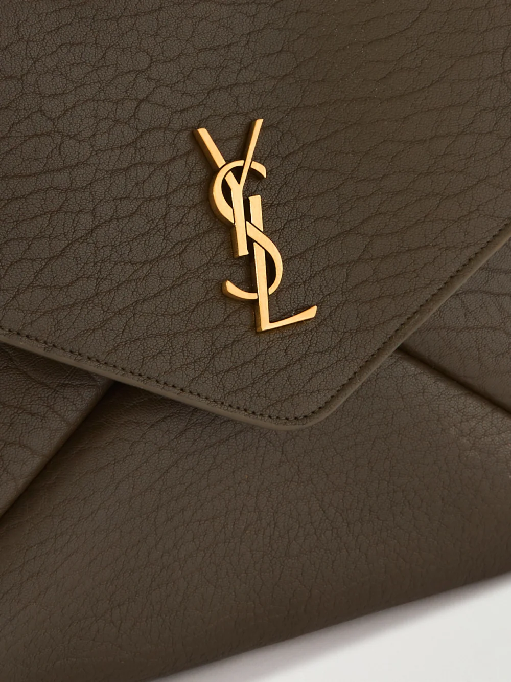 Close-up detail of the Saint Laurent Cassandre Large Textured-leather Clutch